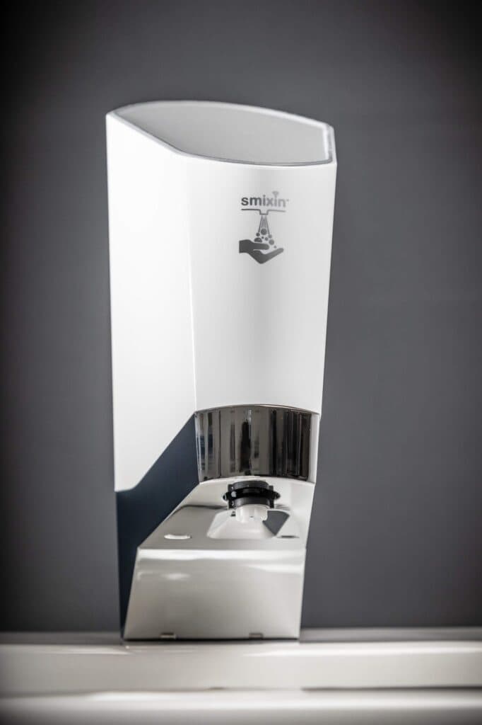 Smixin Compact dispenser installed beside a sink