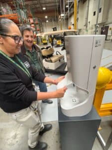 Workers using a Smixin handwashing station for workplace hygiene compliance