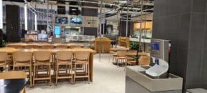 Smixin automatic handwashing system beside a restaurant dining area