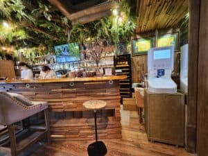 Smixin automatic handwashing system in a rustic restaurant interior