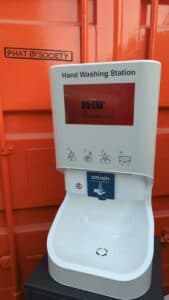 Freestanding Smixin handwashing station at an outdoor hospitality venue