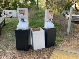Two Smixin automatic handwashing stations set up for an outdoor event