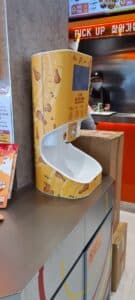 Smixin automatic handwashing system at a hospitality food counter