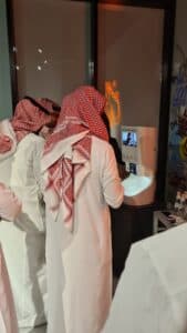 Hospitality guest using a Smixin automatic handwashing station