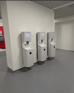 Three Smixin handwashing stations installed in a healthcare facility