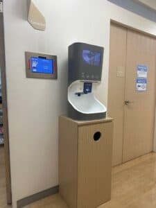 Smixin automatic handwashing station installed in a healthcare corridor
