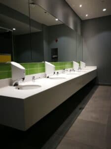 Smixin touch-free handwashing systems in a modern public washroom