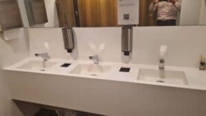 Touch-free Smixin handwashing systems across a public washroom basin